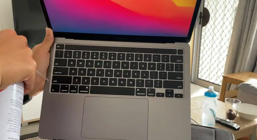 Cleaning Macbook keyboard with compressed air 